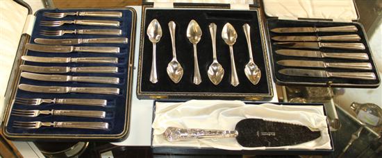 Cased silver dessert eaters, silver grape fruit spoons, silver cake slice and knives